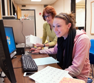 Student and faculty member working on a project